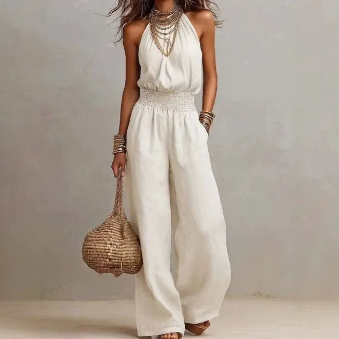 Chic women's wide leg halter jumpsuit in a flowing fabric for effortless comfort, ideal for resort wear.