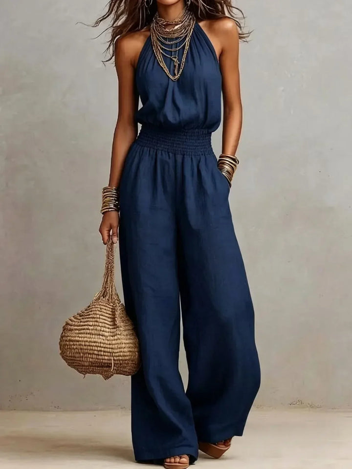 Versatile women's wide leg halter jumpsuit, a chic and comfortable one-piece suitable for casual or vacation style.