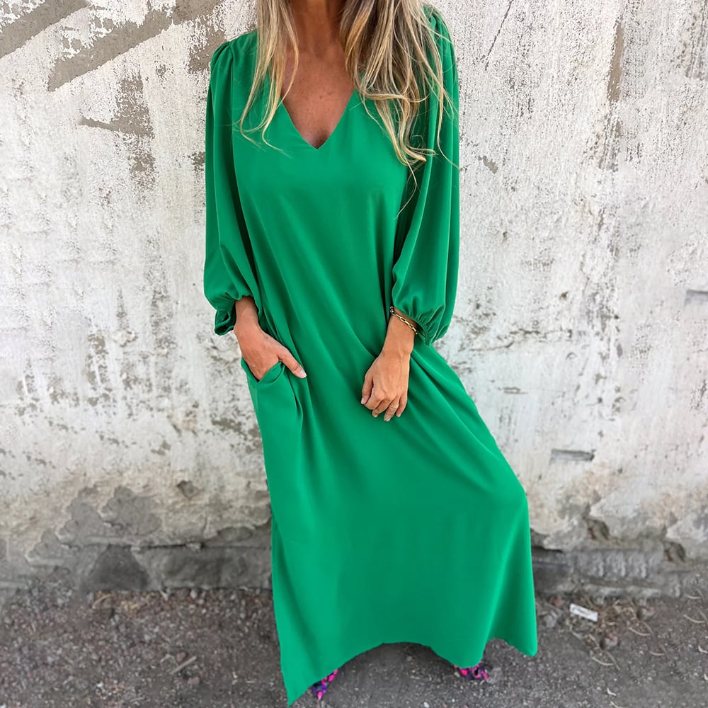 Stylish women's summer maxi dress featuring a flowy design, elegant balloon sleeves, V-neck, and essential pockets.