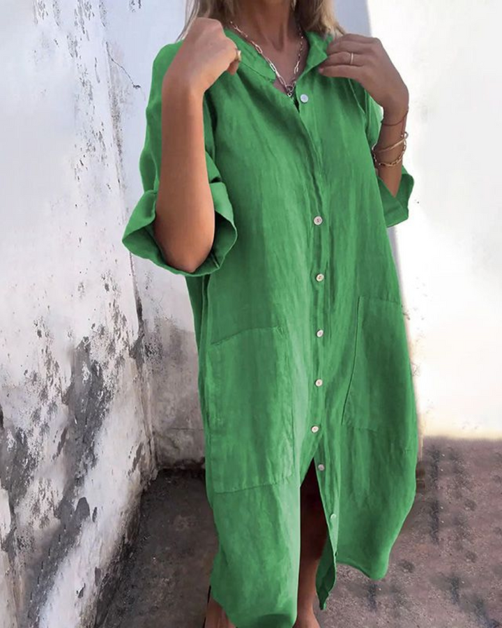 Close-up of a women's boho shirt dress, showcasing the button closure detail & adjustable tie waist.