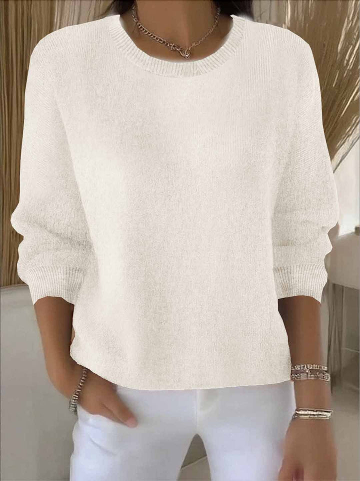Chic women's flowy sweater. Relaxed fit long sleeve knit, perfect for versatile layering.
