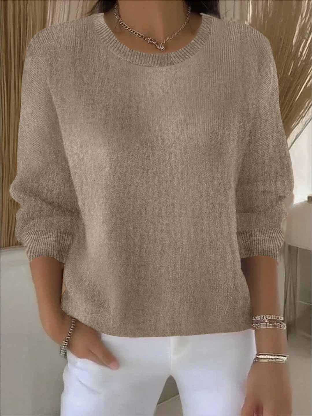 Cozy chic women's flowy knit top. Versatile long sleeve sweater for autumn & winter comfort.