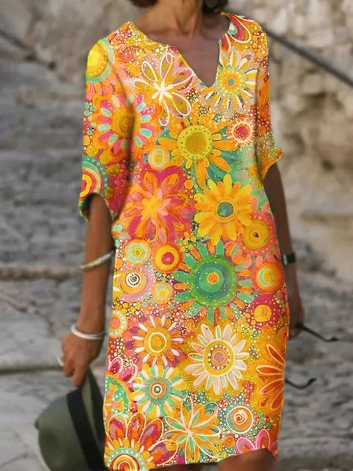 Women's flowy floral sleeveless midi dress for spring and summer. Comfortable & elegant casual style, perfect vacation wear.