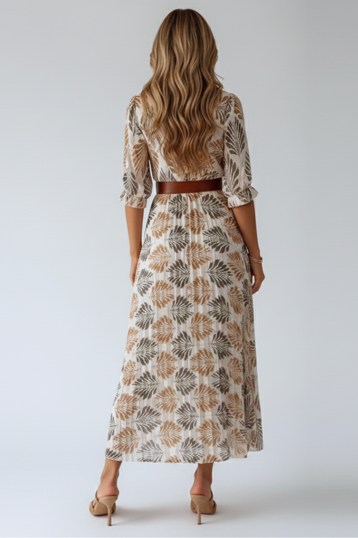 Versatile women's elbow sleeve maxi dress with a vibrant pattern and flowy silhouette, perfect for elegant casual wear.