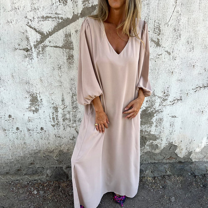 Elegant bohemian maxi dress for women, with flattering V-neckline and chic balloon sleeves.