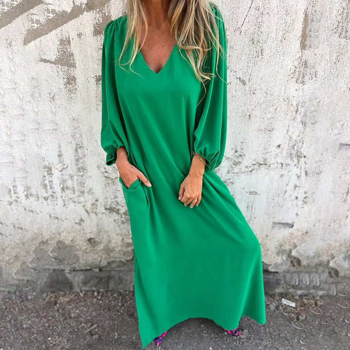 Lightweight women's summer maxi dress featuring a comfortable flowy fit, V-neck, and roomy pockets.