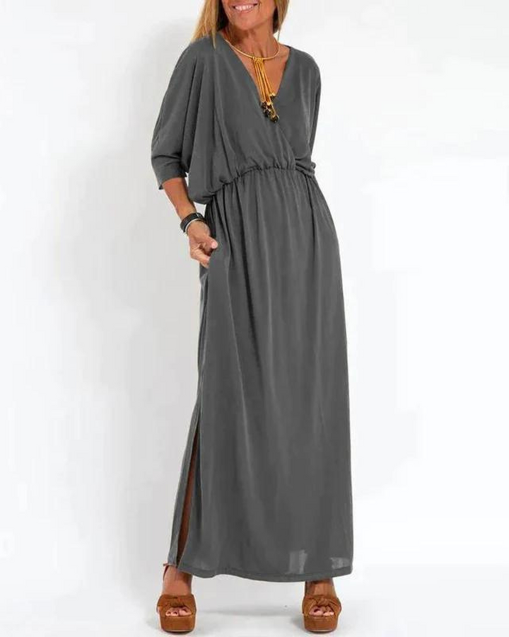Elegant long flowy summer dress for women, featuring adjustable spaghetti straps.