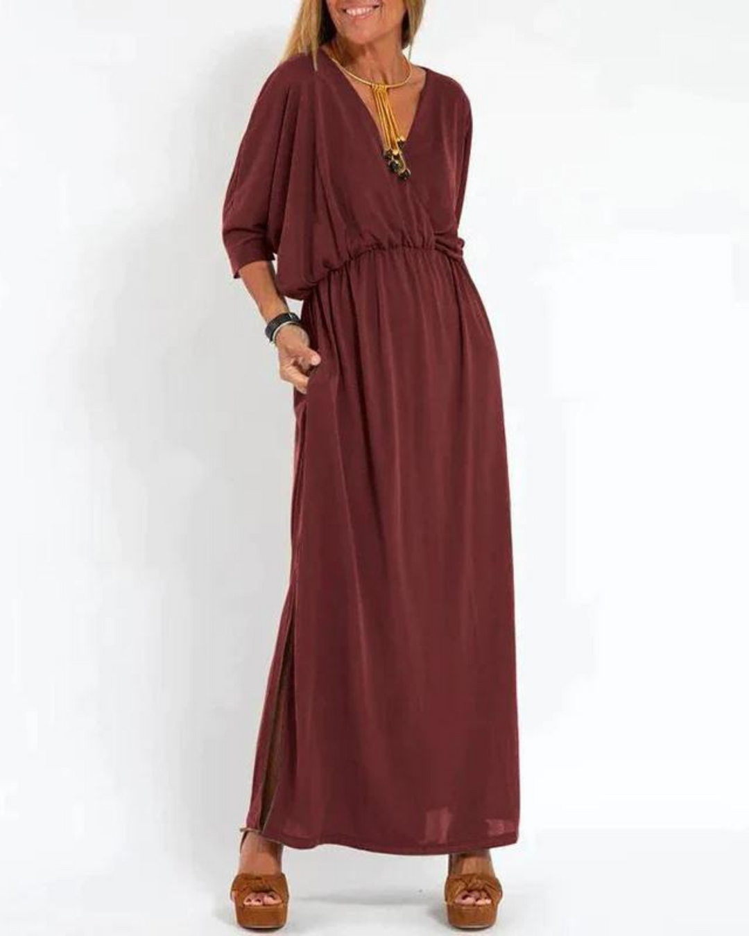 Lightweight flowy summer dress for women, midi length & adjustable straps for warm weather.