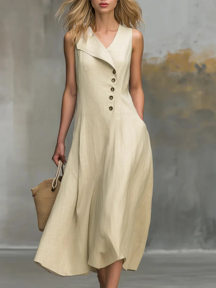 Women's flowy midi dress with button detail, V-neck, and relaxed fit. Perfect for casual everyday wear.