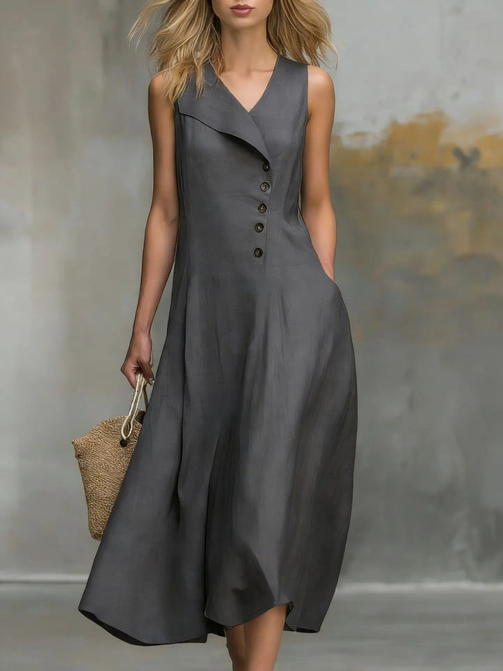 Sleeveless flowy midi dress for women, featuring a stylish button detail and V-neck. Ideal for summer fashion.