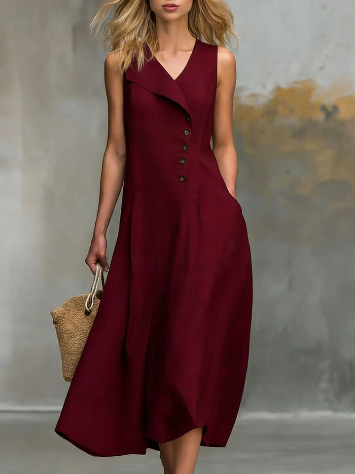Relaxed fit women's midi dress with chic button detail and V-neck. Comfortable, flowy, and perfect for spring.