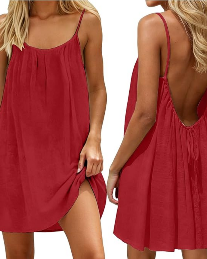 Vibrant women's mini summer dress with open back, ideal for beachwear, vacation, or warm weather.