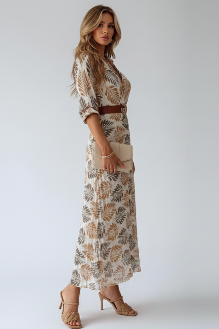 Elegant women's patterned maxi dress. Flowy fabric & elbow sleeves for comfortable spring/summer fashion.
