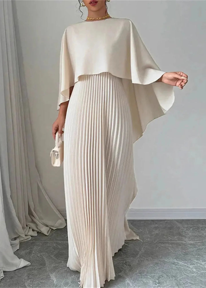 Women's flowy pleated maxi dress with elegant cape overlay. Perfect as a wedding guest or black-tie formal evening gown.
