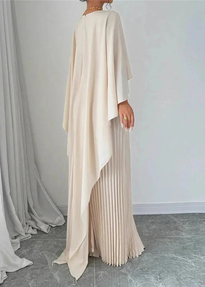 Elegant crew neck pleated maxi dress featuring a chic cape overlay. Ideal for formal events, special occasions & evening wear.