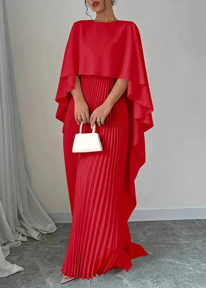 Sophisticated women's pleated maxi dress with an attached cape, a timeless formal gown for wedding guests & black tie events.