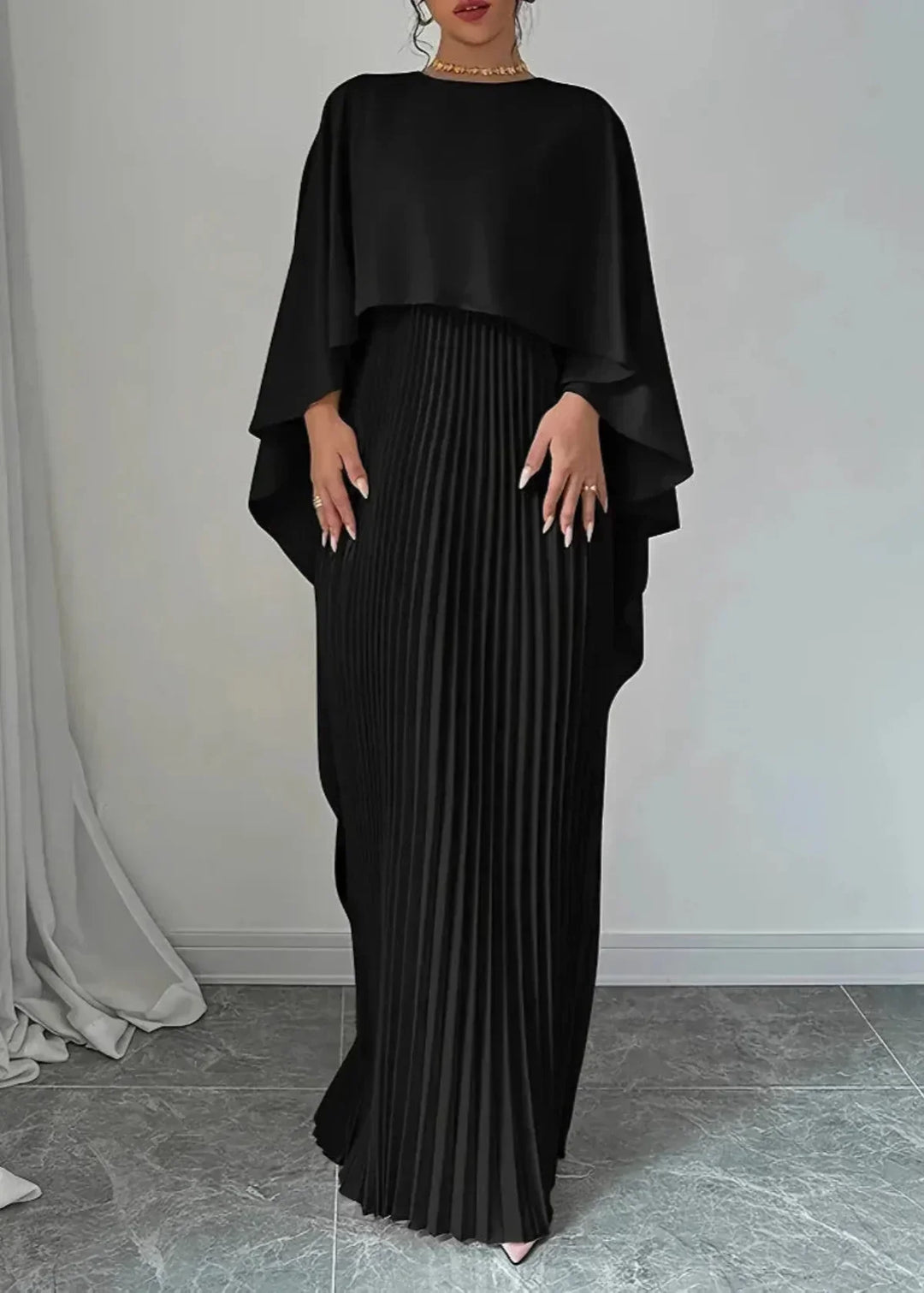 Chic & elegant flowy pleated evening gown with a graceful cape overlay. Perfect women's formal dress for special occasions.