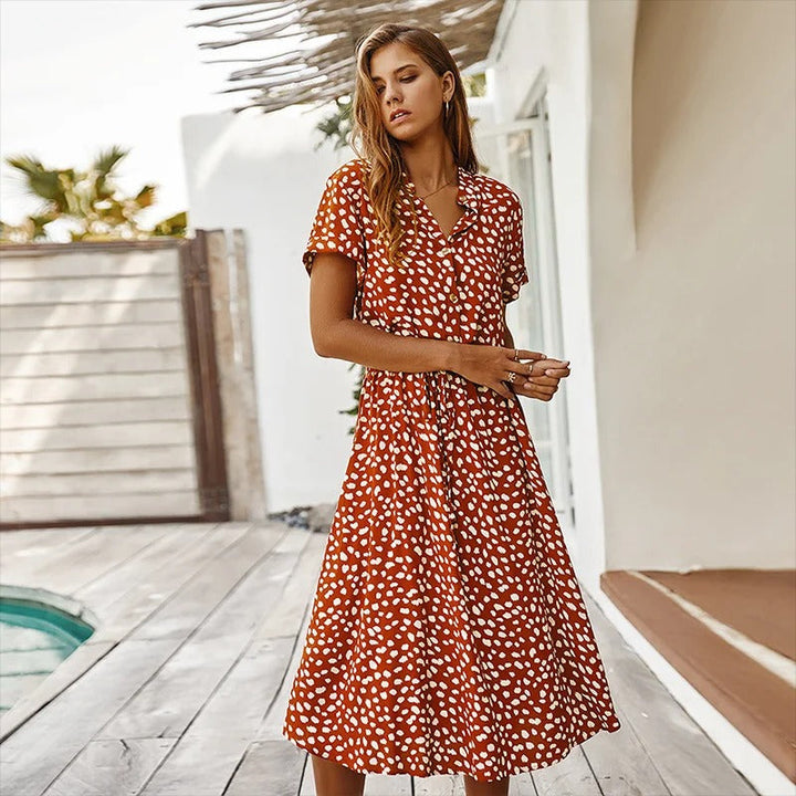 Casual flowy printed midi dress for women, ideal for summer vacation or warm weather fashion.