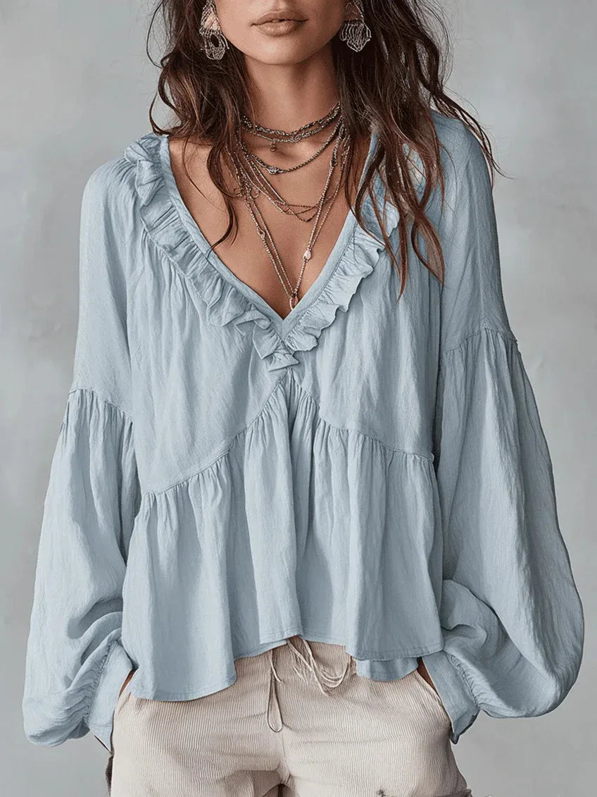 Stylish women's relaxed fit blouse with delicate ruffles. Perfect casual or elegant top for summer.