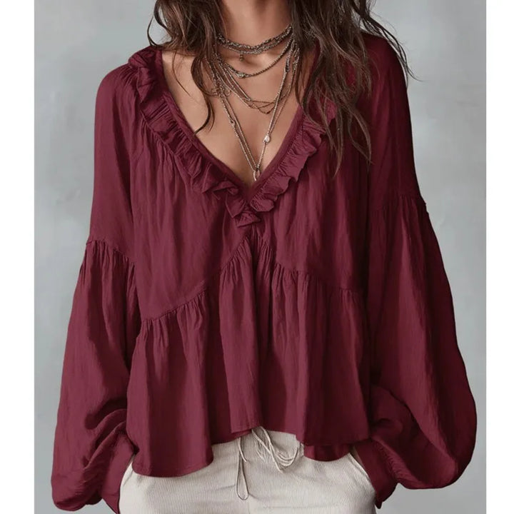 Soft flowy women's top with pretty ruffles, V-neck, and long sleeves. Effortlessly chic blouse.
