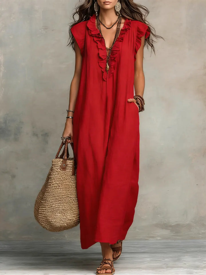 Boho beach flowy maxi dress for women, V-neck, flutter sleeves, and charming ruffle accents.