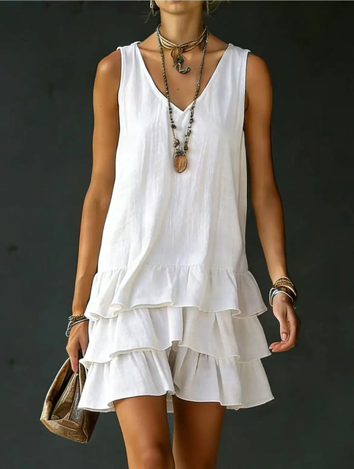 Stylish women's tiered ruffle mini dress, a sleeveless V-neck for a comfortable and flowy summer look.