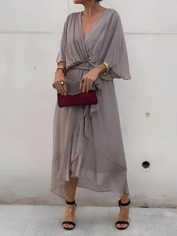 Women's versatile flowy V-neck maxi dress with an adjustable belt, great for warm weather.