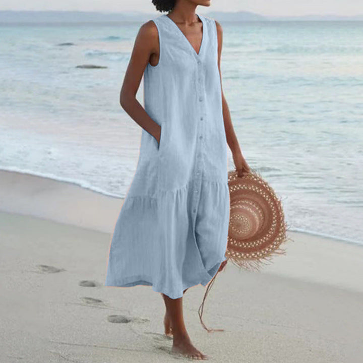 Flowy A-line women's V-neck midi summer dress with button front and tiered skirt, offering relaxed fit.