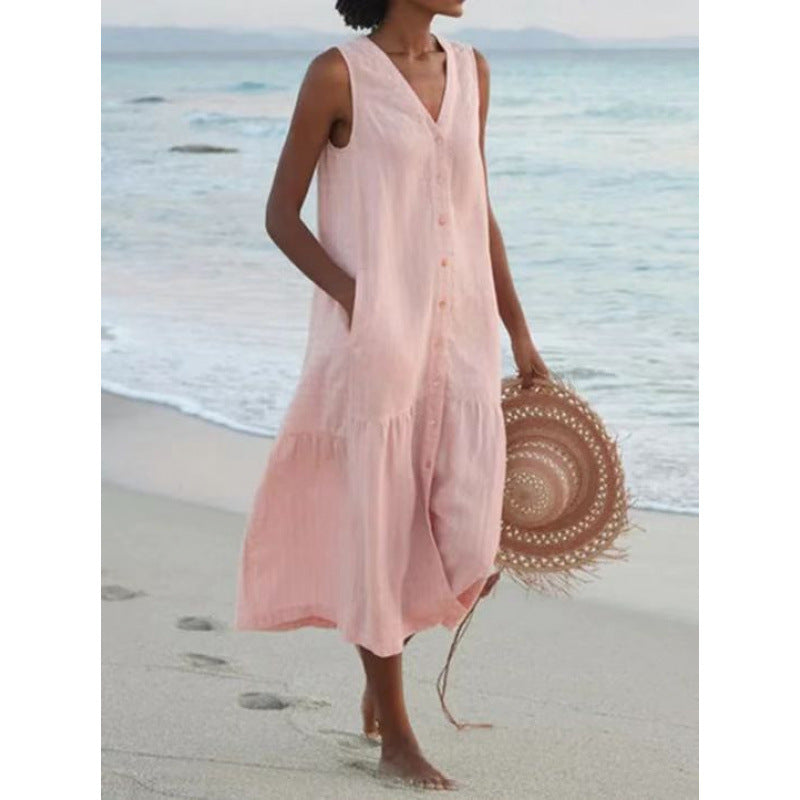 Women's V-neck button front tiered midi dress. Sleeveless, flowy summer dress, ideal for beach and vacation.