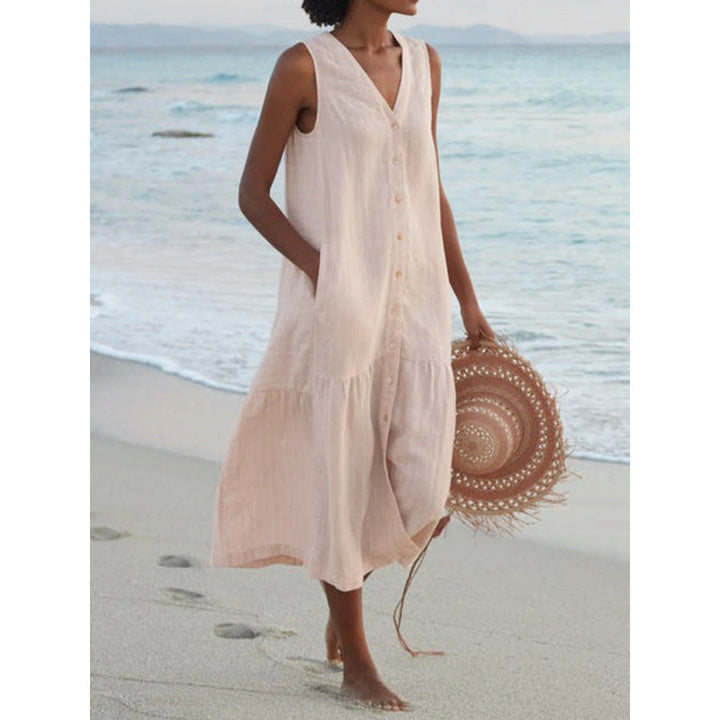 Chic women's summer midi dress, sleeveless V-neck, button front detail, and flowy tiered design for vacation.