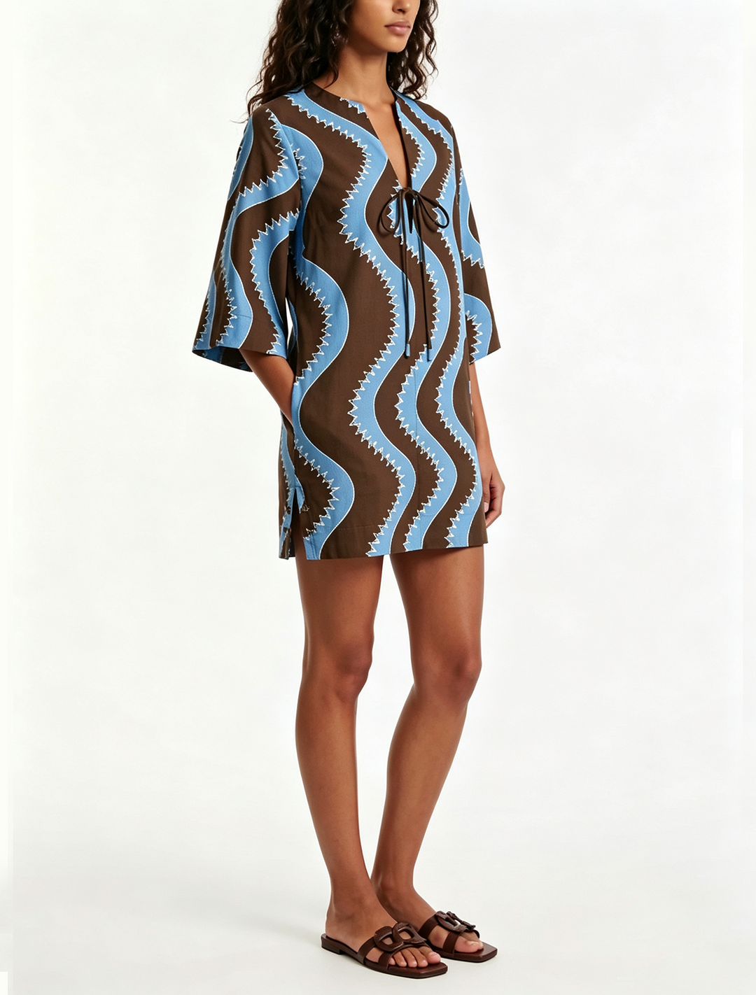Stylish women's collared button-front mini dress in an effortless wave print. Ideal for brunch, beach, or casual wear.