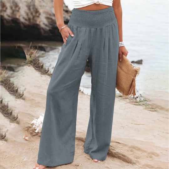 Comfortable women's flowy wide leg summer pants, featuring an elastic waist for a relaxed, fashionable fit.