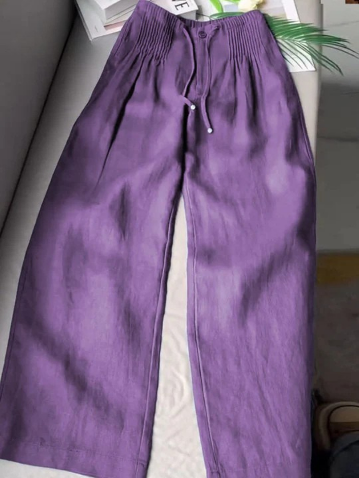 Women's wide-leg pants featuring an elastic waist, versatile for casual & stylish outfits.