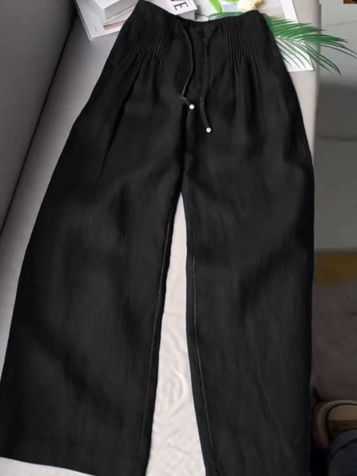 Elegant flowy wide-leg trousers for women, offering a graceful silhouette and comfort.