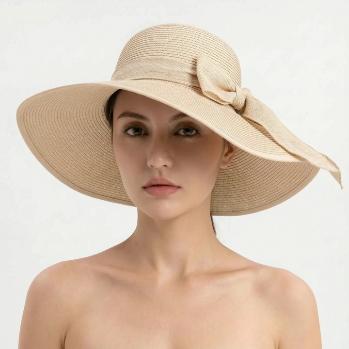 Versatile women's travel sun hat, wide brim and foldable for easy packing, ideal for sunny vacation days.