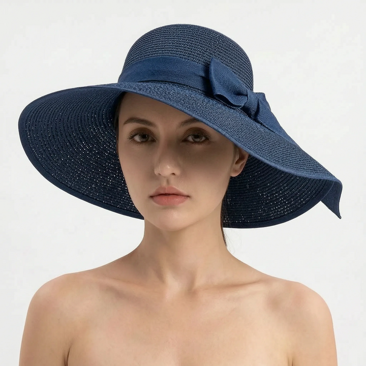 Women's UV protection sun hat, wide brim design, foldable for effortless travel and stylish beach wear.