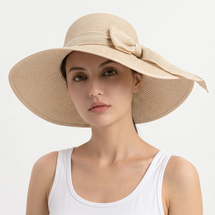 Chic women's wide brim sun hat, easily foldable for travel & providing excellent UV protection for summer.