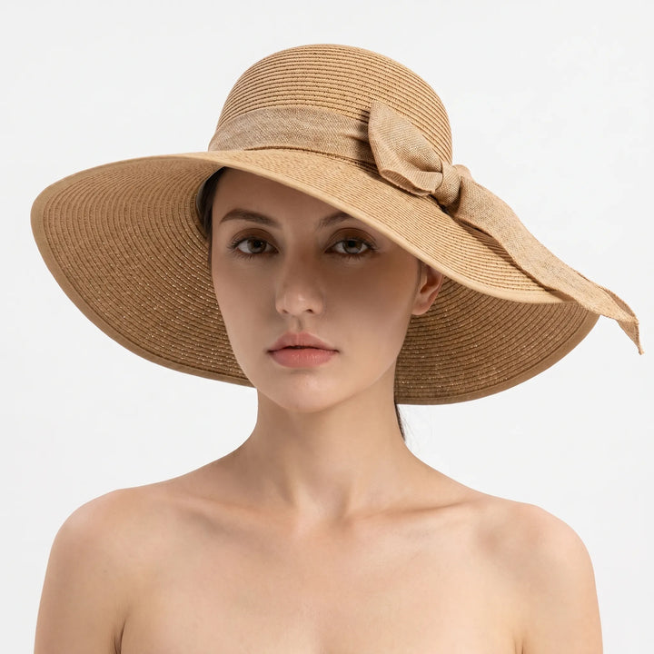 Elegant foldable wide brim sun hat for women, perfect for travel, offering sun protection & a fashion statement.