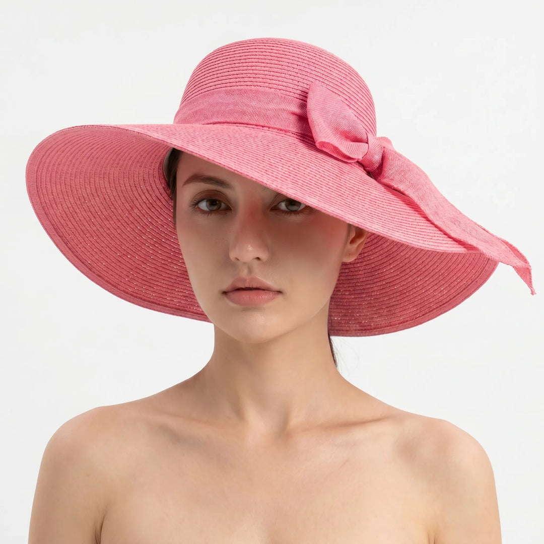Stylish wide brim sun hat for women, foldable and packable, essential for beach vacations & sunny adventures.