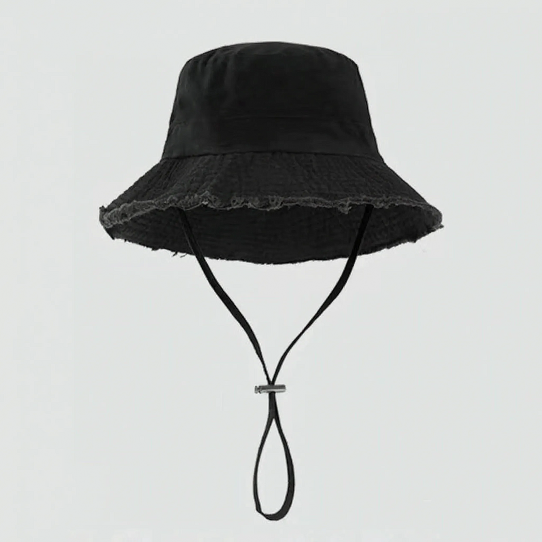 Adjustable women's sun protection bucket hat with trendy frayed brim for summer adventures.