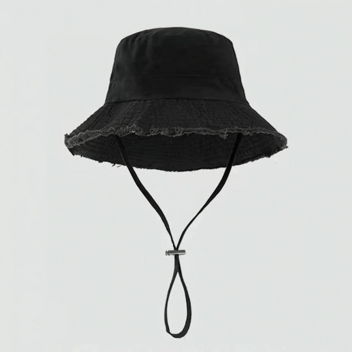 Adjustable women's sun protection bucket hat with trendy frayed brim for summer adventures.