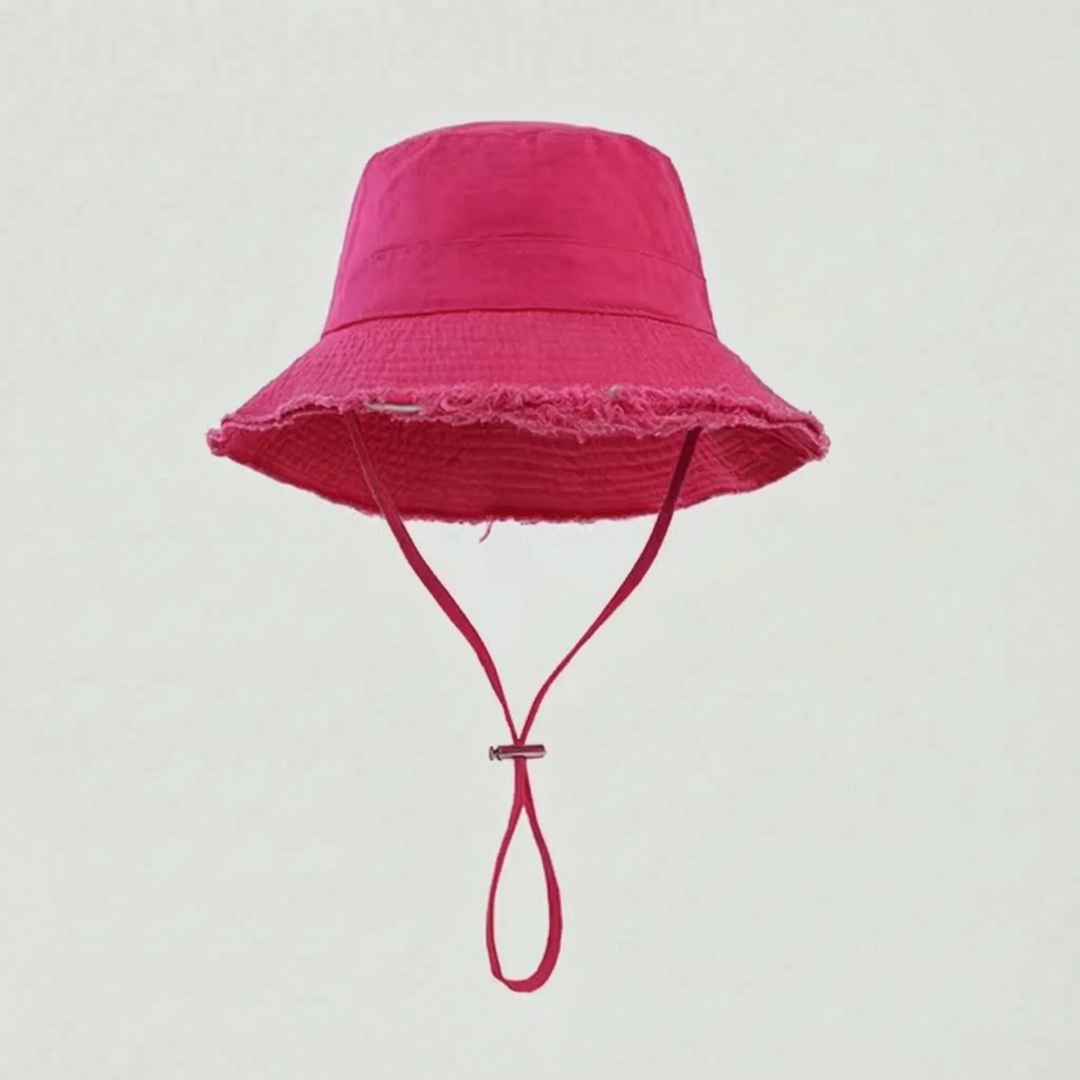 Women's summer bucket hat, frayed brim, solid color. Great for casual wear and sun protection.