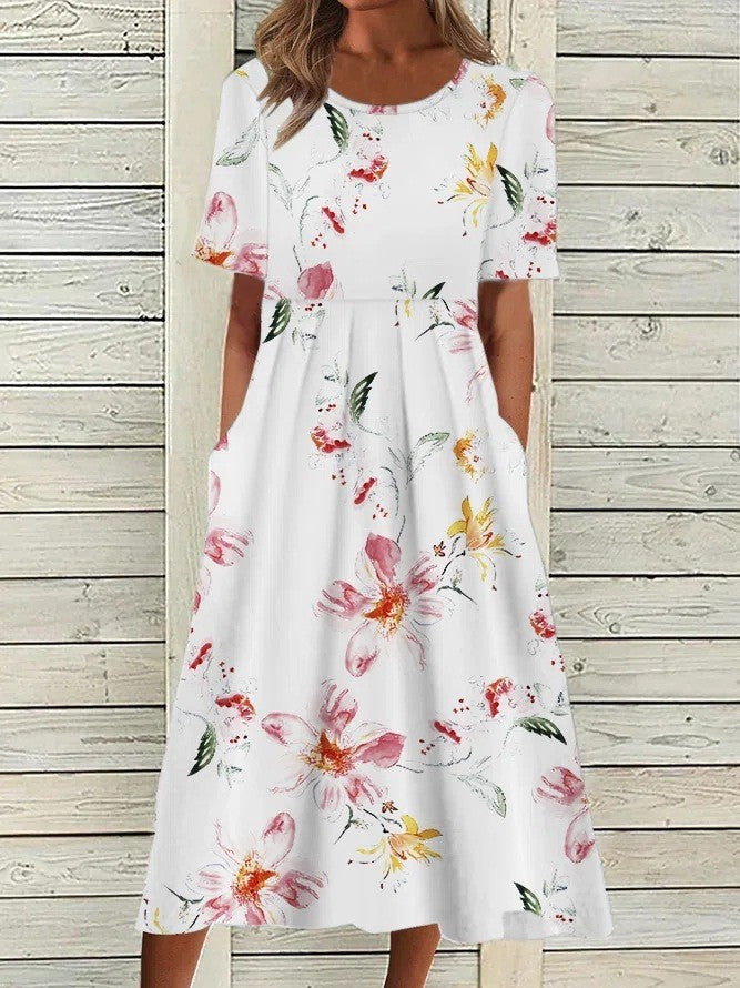 Sophisticated women's floral midi dress, A-line, round neck, short sleeve. Ideal for spring occasions.