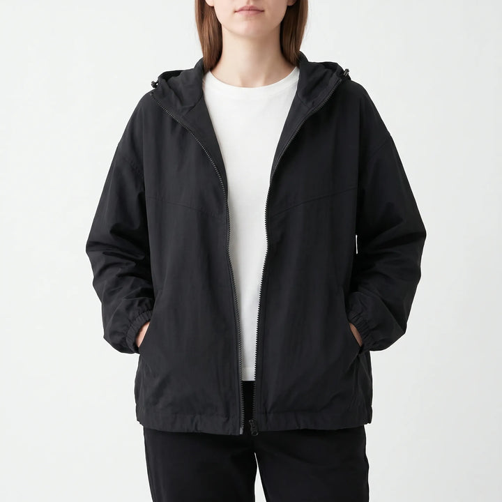 Lightweight women's casual hooded windbreaker. Perfect transitional outerwear for spring and fall fashion.