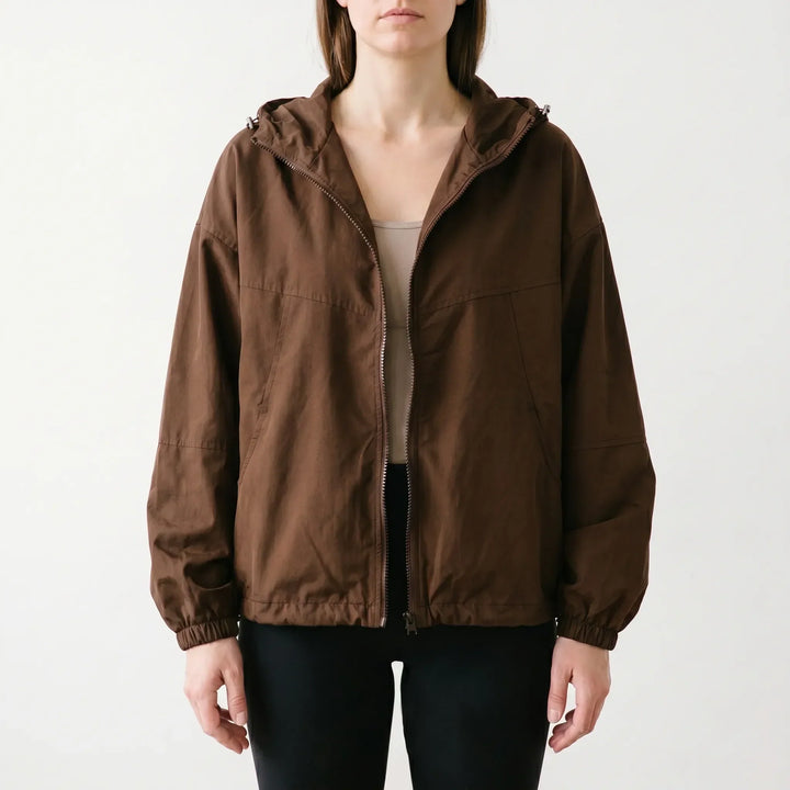 Casual women's hooded windbreaker jacket. Lightweight outerwear with full zip, perfect for transitional spring & fall.