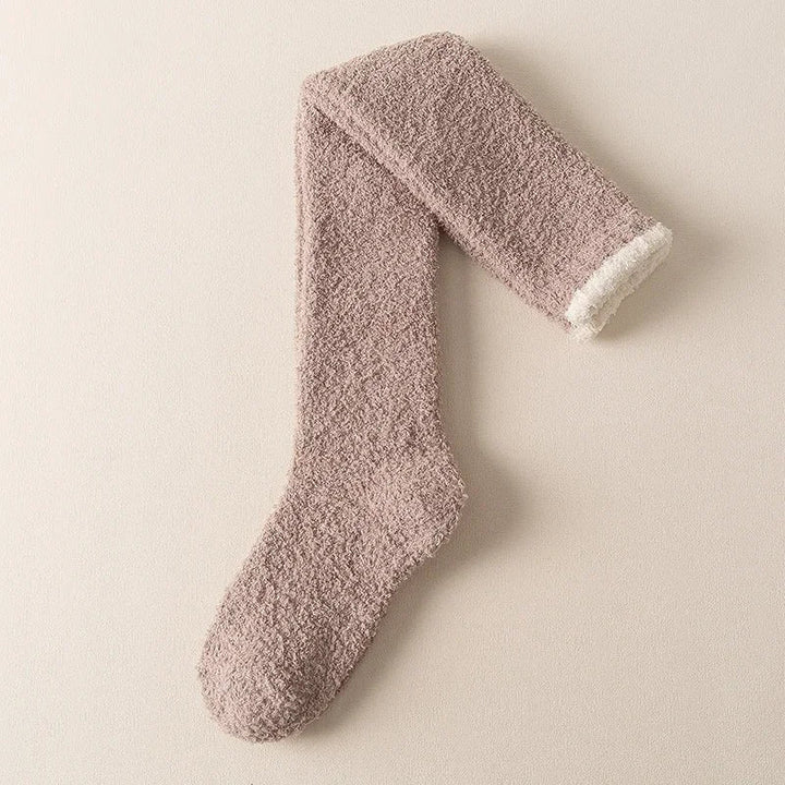 Ultra-comfortable women's fuzzy knee high socks, perfect for cozy warmth in winter. Soft solid color loungewear.