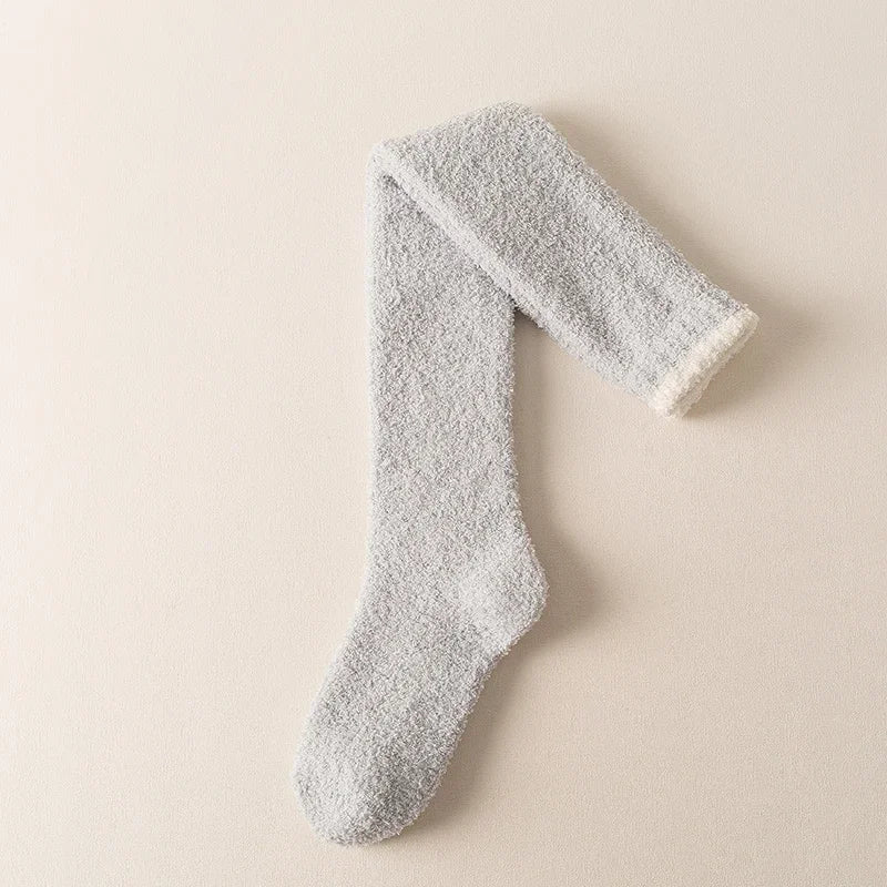 Warm winter fuzzy knee high socks for women. Cozy solid color loungewear, designed for ultimate comfort and softness.