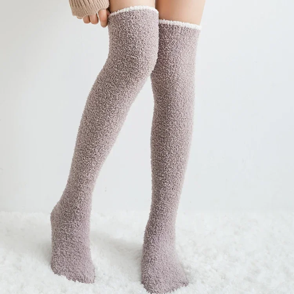 Cozy women's fuzzy knee high socks, ideal for relaxing comfort. Warm solid color winter loungewear for ultimate coziness.
