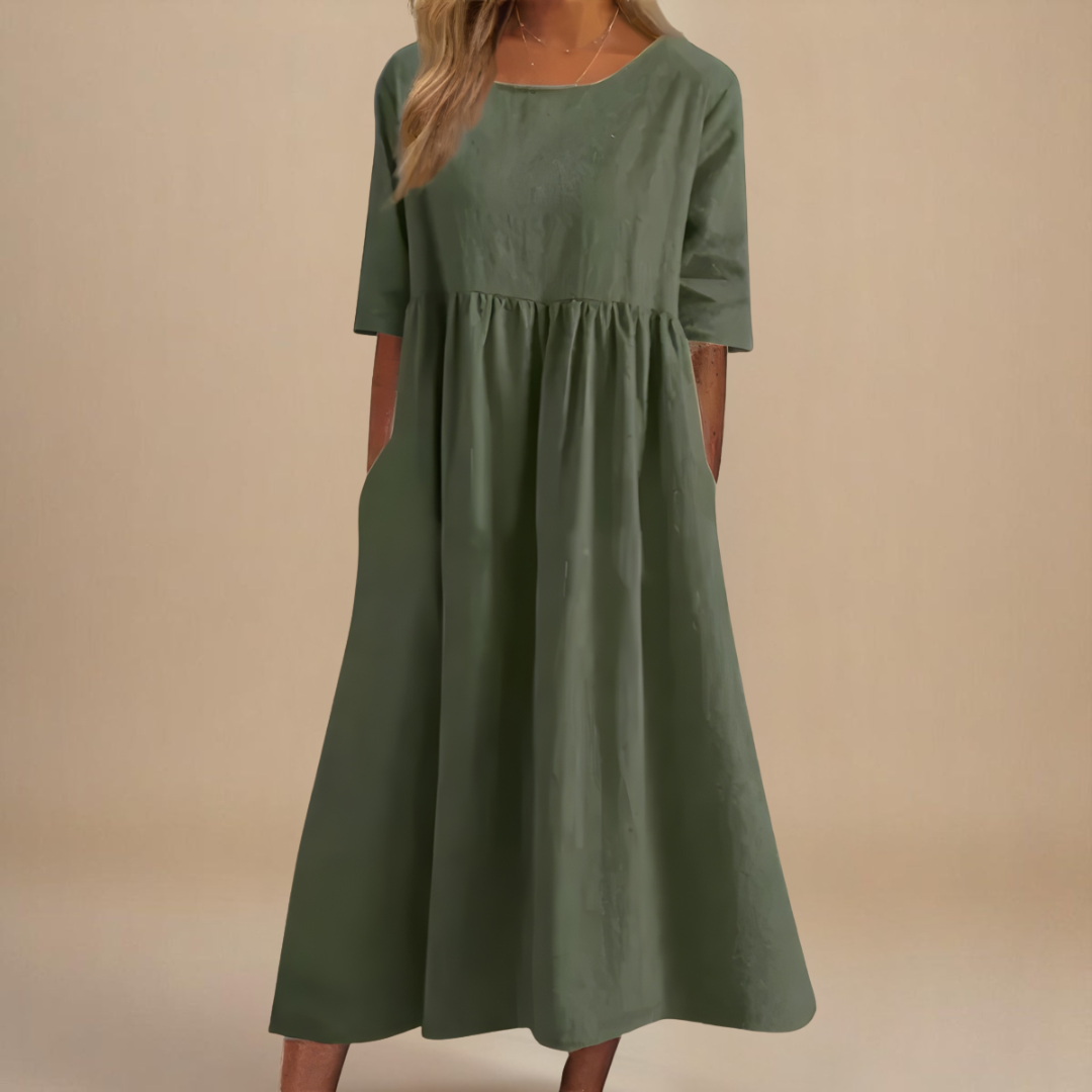 Women's gathered waist half-sleeve midi dress. Flowy, casual, and perfect for summer everyday wear.