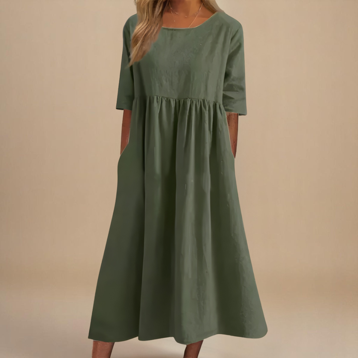 Women's gathered waist half-sleeve midi dress. Flowy, casual, and perfect for summer everyday wear.